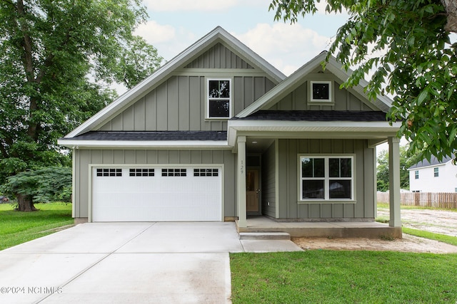 view of front of property with a garage and a front yard