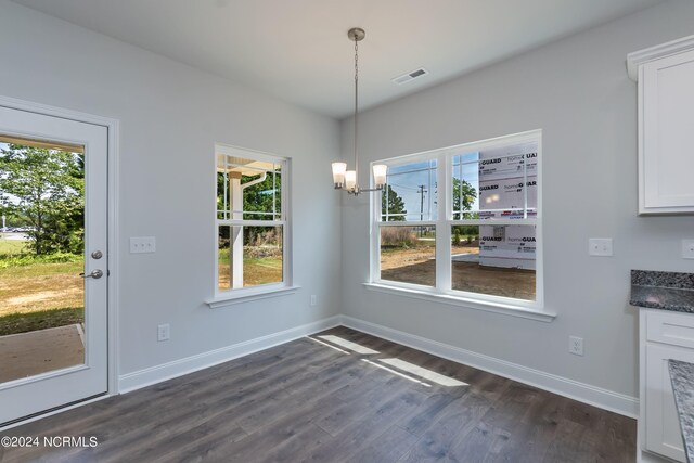 kitchen with a center island with sink, sink, a healthy amount of sunlight, white cabinetry, and stainless steel appliances