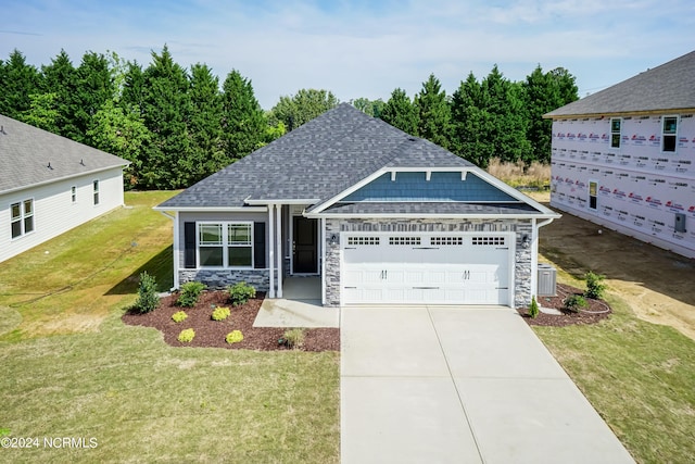 view of front facade with a garage and a front lawn