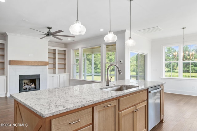 141 Sycamore Lakes Dr, Wallace, NC 28466 - kitchen featuring a sink, dishwasher, ornamental molding, dark wood finished floors, and light stone counters