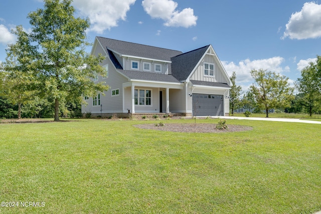 view of front facade with a garage and a front lawn