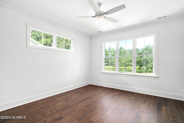 spare room featuring ceiling fan, dark hardwood / wood-style floors, and ornamental molding