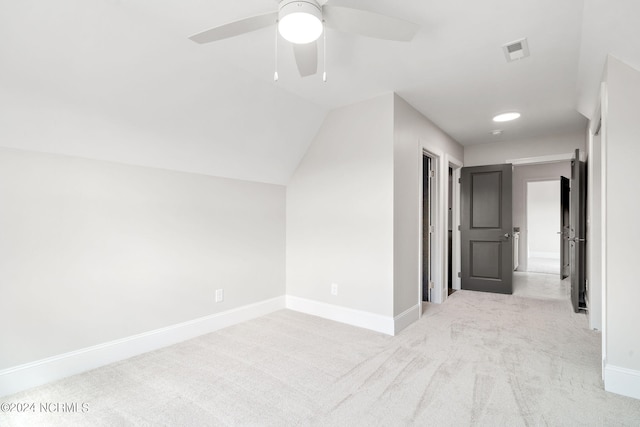 bonus room featuring light carpet, ceiling fan, and vaulted ceiling