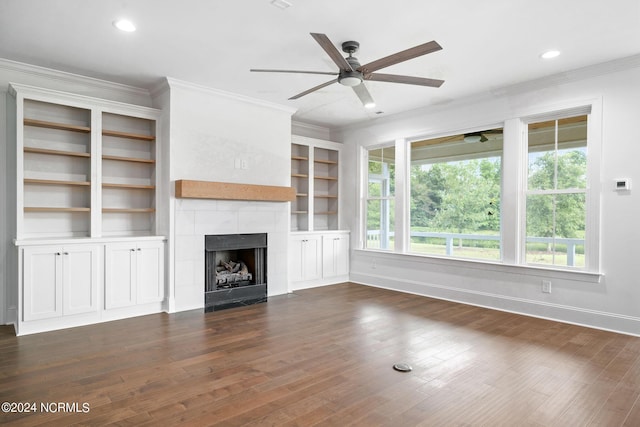 141 Sycamore Lakes Dr, Wallace, NC 28466 - unfurnished living room featuring a ceiling fan, a tile fireplace, dark wood finished floors, ornamental molding, and baseboards