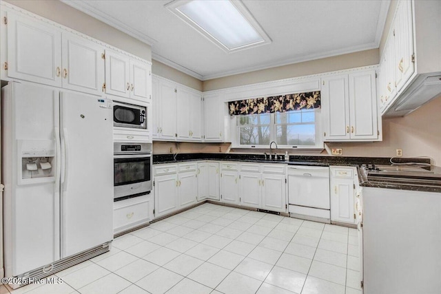 kitchen featuring white cabinetry, sink, light tile patterned floors, stainless steel appliances, and crown molding