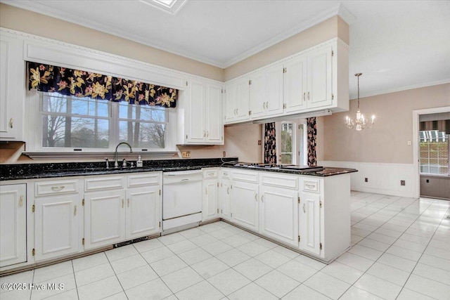 kitchen with pendant lighting, sink, dishwasher, white cabinets, and kitchen peninsula