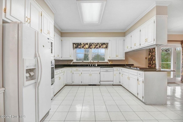 kitchen with sink, white cabinetry, ornamental molding, kitchen peninsula, and white appliances