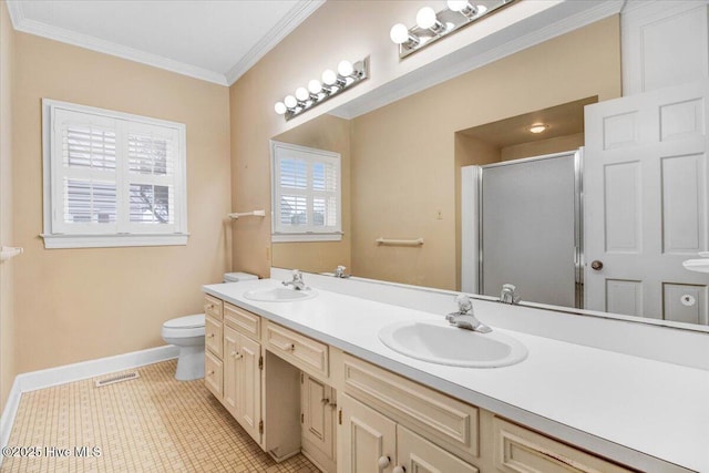 bathroom with tile patterned flooring, vanity, toilet, a shower with door, and crown molding