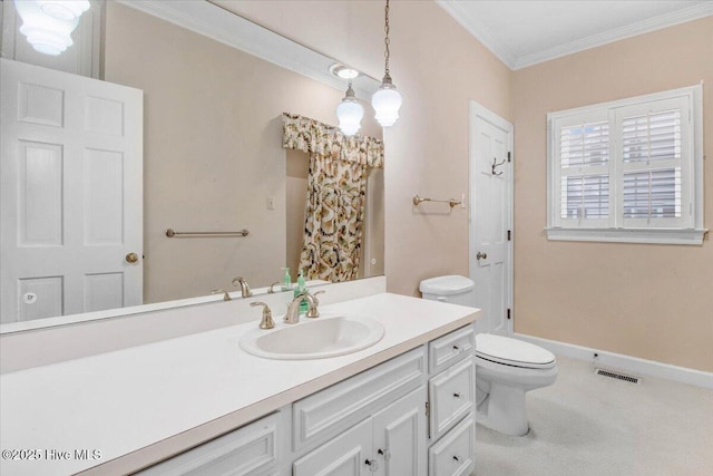 bathroom with ornamental molding, toilet, and vanity