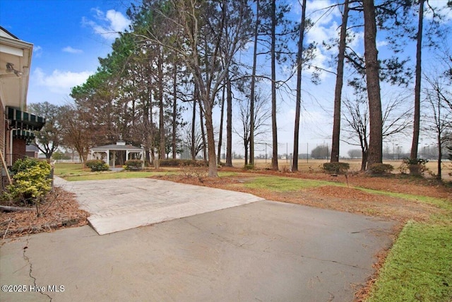 view of yard featuring a gazebo and a patio area