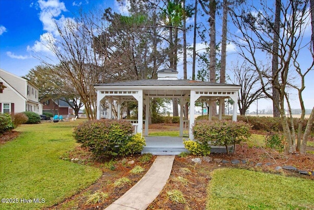 view of property's community with a gazebo and a yard