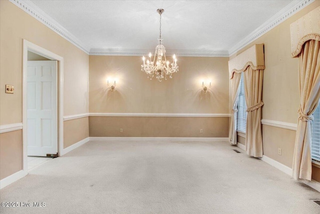 spare room with ornamental molding, light carpet, and an inviting chandelier