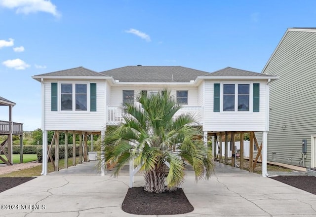 beach home featuring a carport