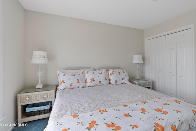 bedroom featuring carpet and a closet