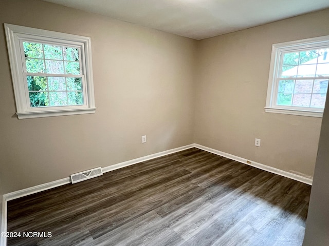 empty room featuring hardwood / wood-style flooring