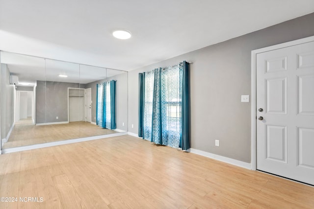 spare room featuring light hardwood / wood-style floors