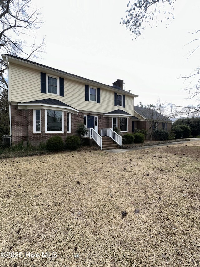 traditional home with brick siding