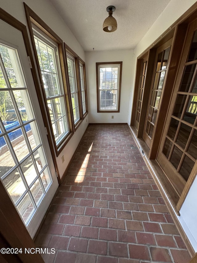 unfurnished sunroom with visible vents