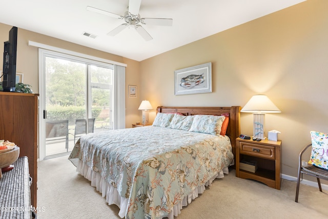 carpeted bedroom with ceiling fan and access to outside