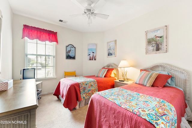 bedroom with light carpet and ceiling fan