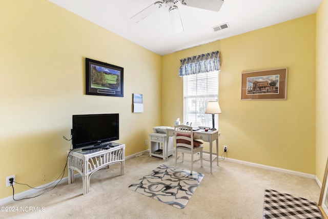 office space with light carpet and ceiling fan