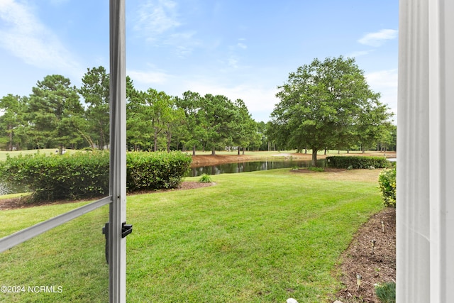 view of yard with a water view