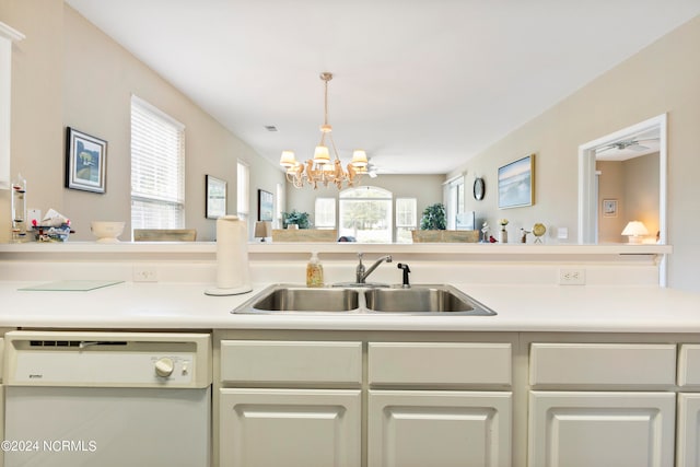 kitchen with an inviting chandelier, sink, and dishwasher