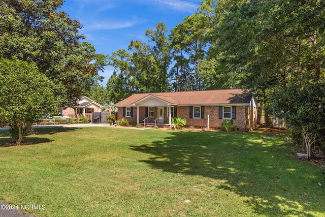 single story home featuring a front yard