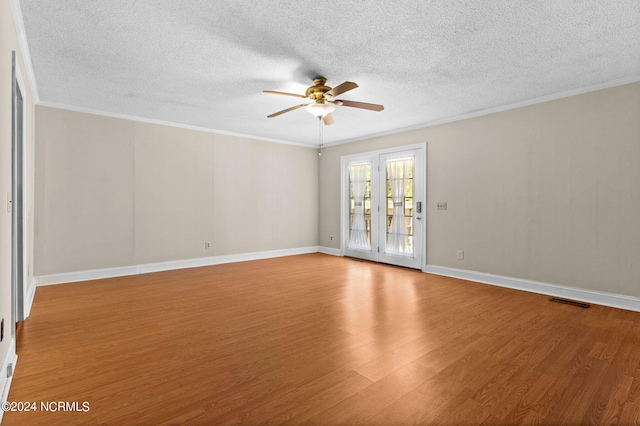 spare room with ceiling fan, hardwood / wood-style flooring, crown molding, and a textured ceiling