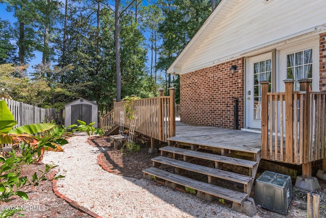 view of yard featuring a storage shed and a deck