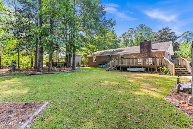 view of yard with a wooden deck