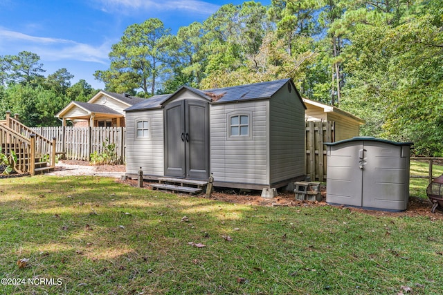 view of outbuilding with a yard