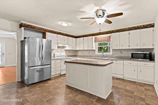 kitchen with ceiling fan, white cabinets, and appliances with stainless steel finishes