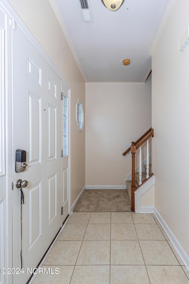 view of tiled foyer entrance