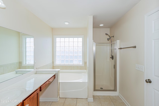 bathroom with vanity, tile patterned floors, and separate shower and tub