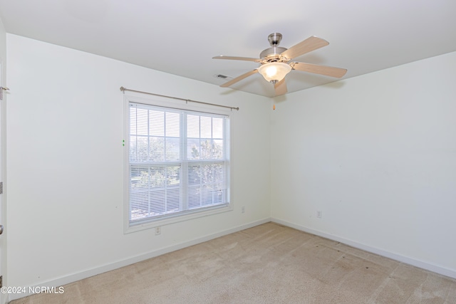 carpeted empty room with ceiling fan