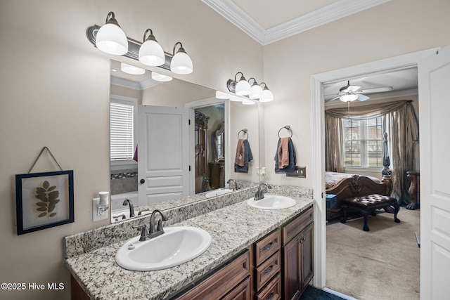 bathroom featuring ceiling fan, crown molding, and vanity