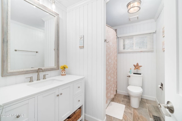 bathroom with crown molding, vanity, toilet, and a shower with shower curtain