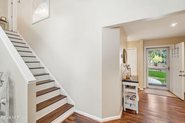 entryway with dark wood-type flooring