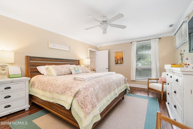 bedroom featuring ornamental molding, dark hardwood / wood-style flooring, and ceiling fan