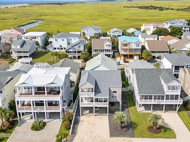 bird's eye view with a residential view and a water view