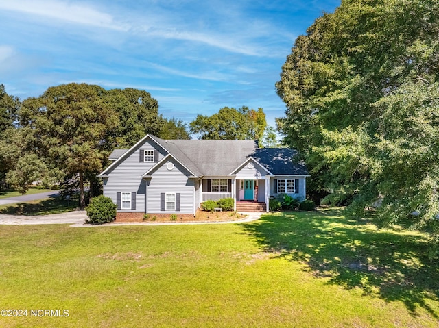 single story home with a front lawn and covered porch