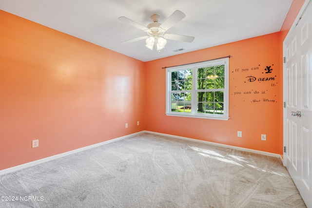 carpeted empty room with ceiling fan