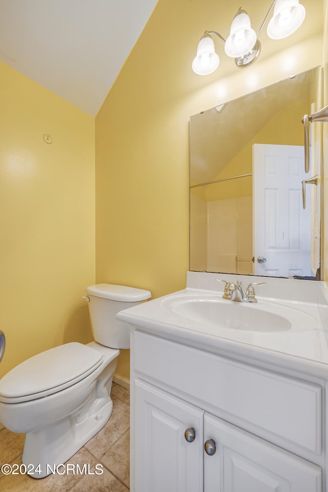 bathroom with toilet, walk in shower, tile patterned flooring, vanity, and vaulted ceiling