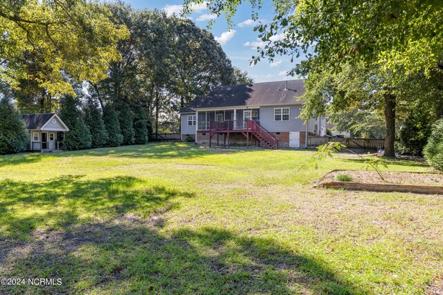 view of yard with a deck