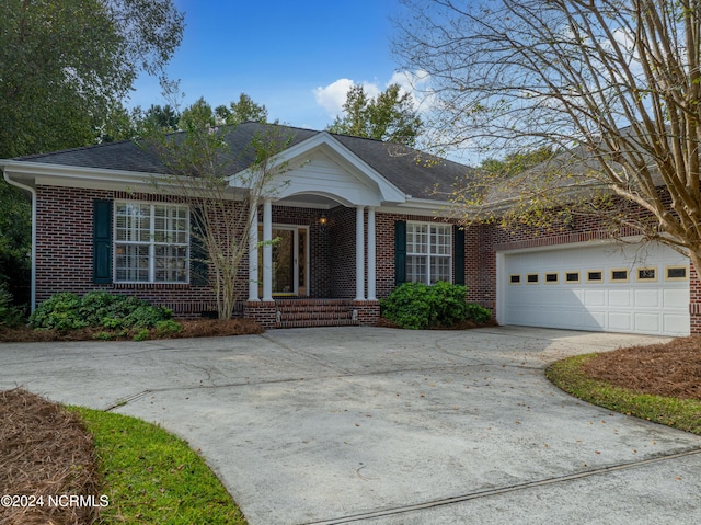 single story home featuring a garage