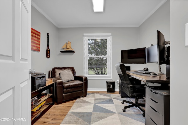 office featuring light hardwood / wood-style flooring and crown molding