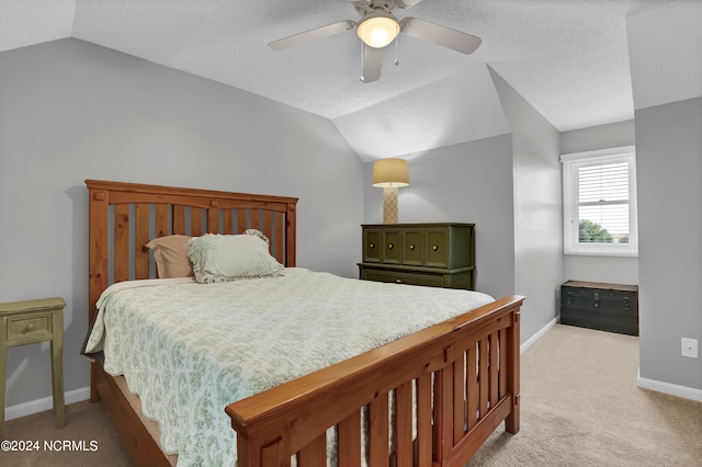 carpeted bedroom with lofted ceiling and ceiling fan