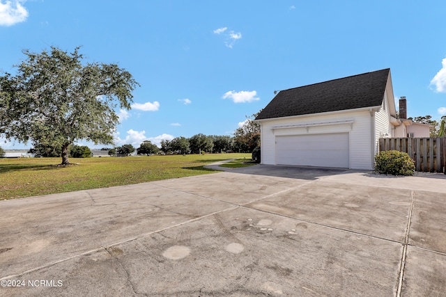 garage featuring a yard