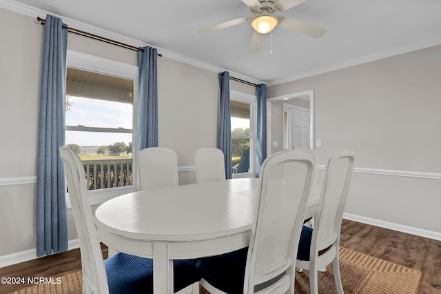 dining area featuring ceiling fan, ornamental molding, and dark wood-type flooring